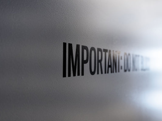 a close up of the word important on a wall