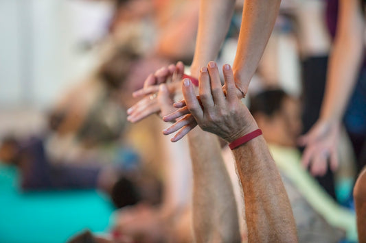 a group of people with their hands in the air