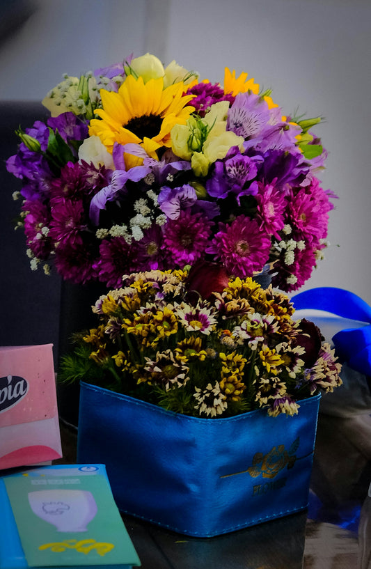 Vibrant bouquet of sunflowers and purple flowers